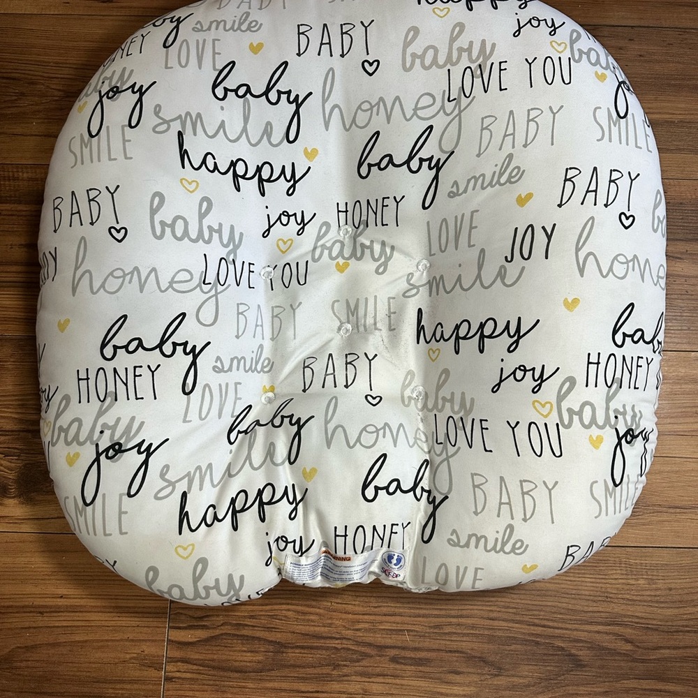 Boppy Pillow with Black and Yellow Text